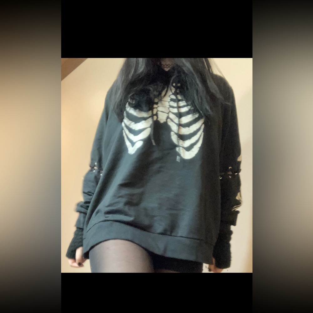 Midnight hour skeletal hoodie, sleeves have laces around the mid arm
